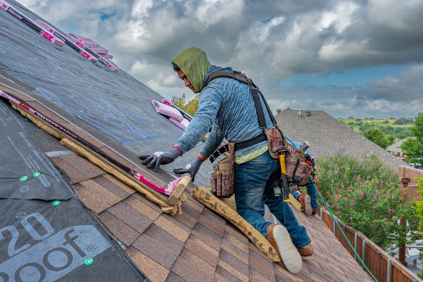 Northline Roofing professional installing architectural shingles on a residential roof
